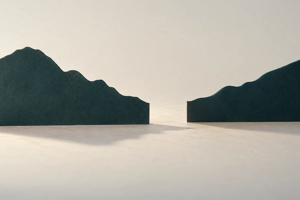 Two terrain-profile silhouettes with an unbridged empty span