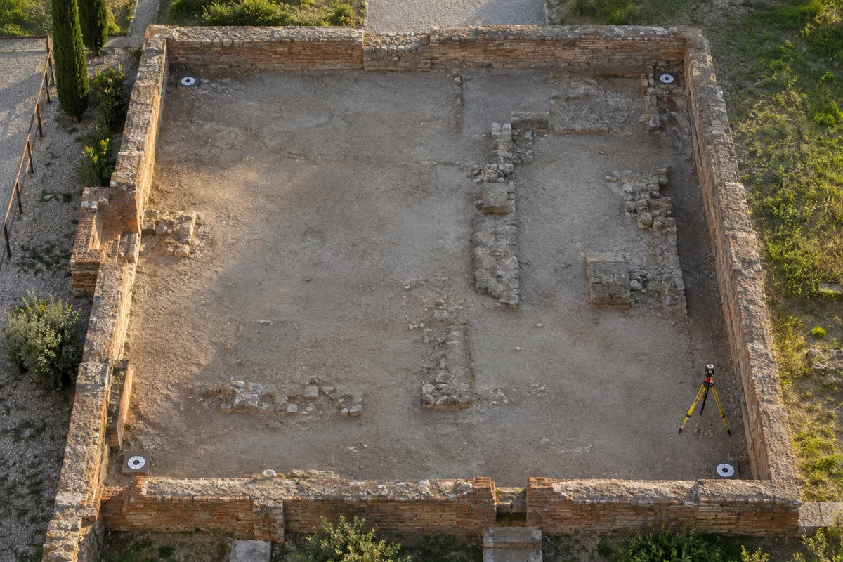 Survey targets around a quiet brick excavation courtyard